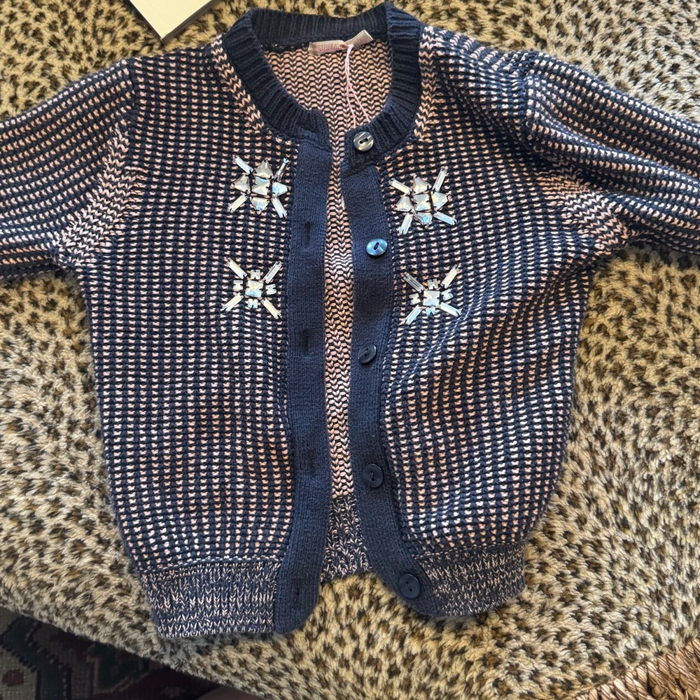 Cutest little girl’s cardigan sweater thick and well made with rhinestone stars